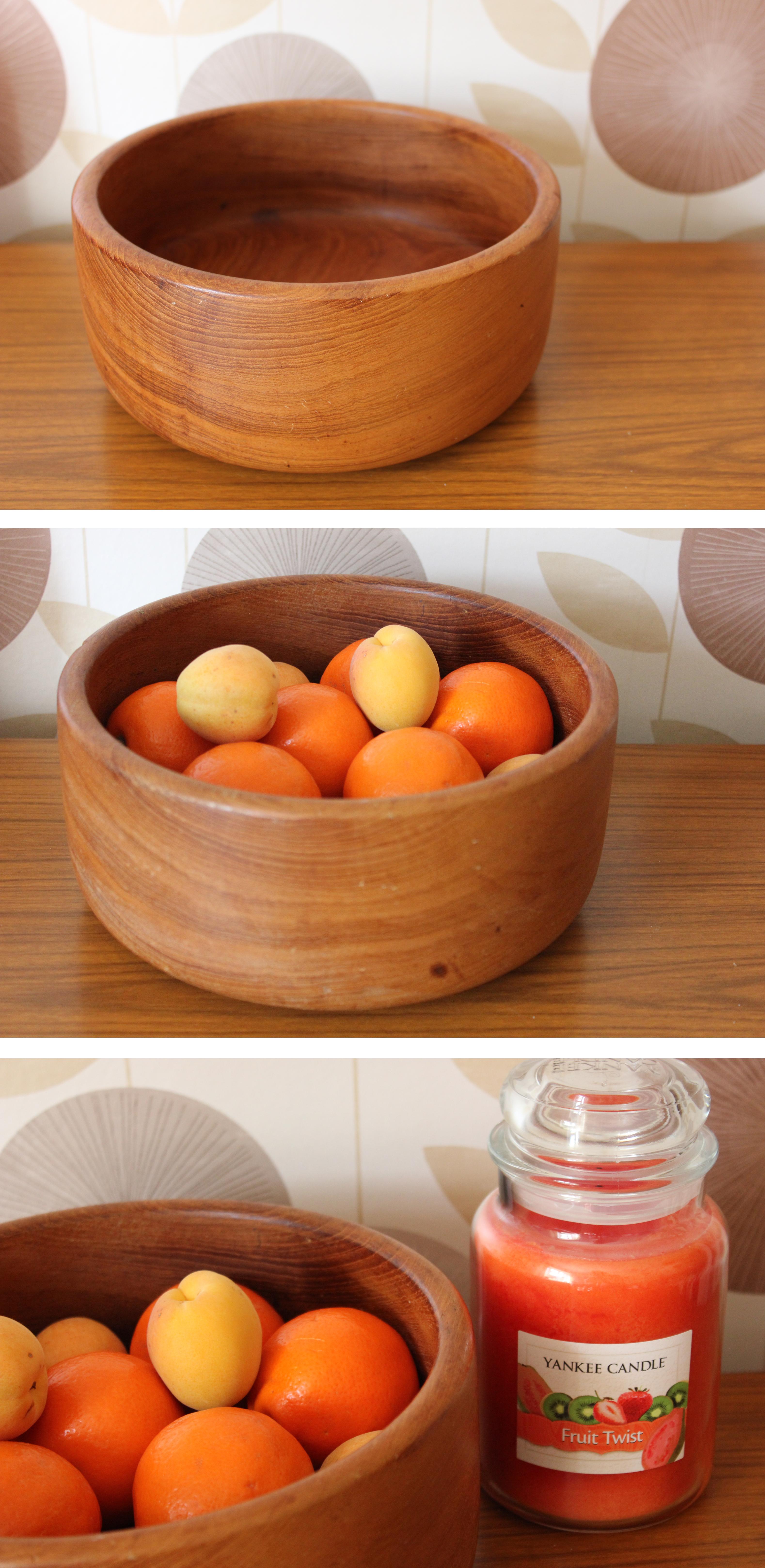 cassiefairys retro midcentury living room design - wooden fruit bowl with autumn oranges and yankee candle