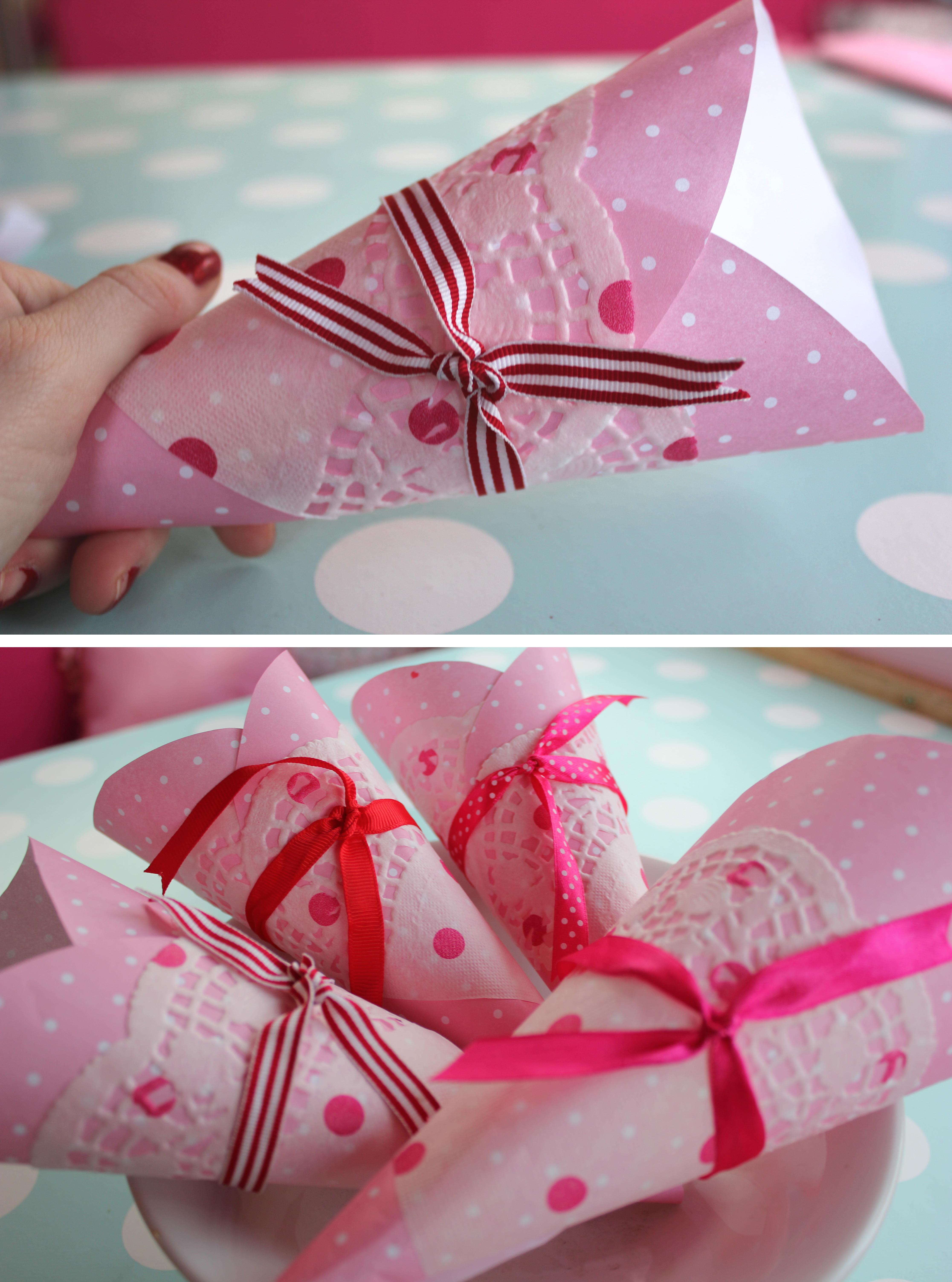 DIY pink paper birthday party cones with doilies for popcorn or sweets