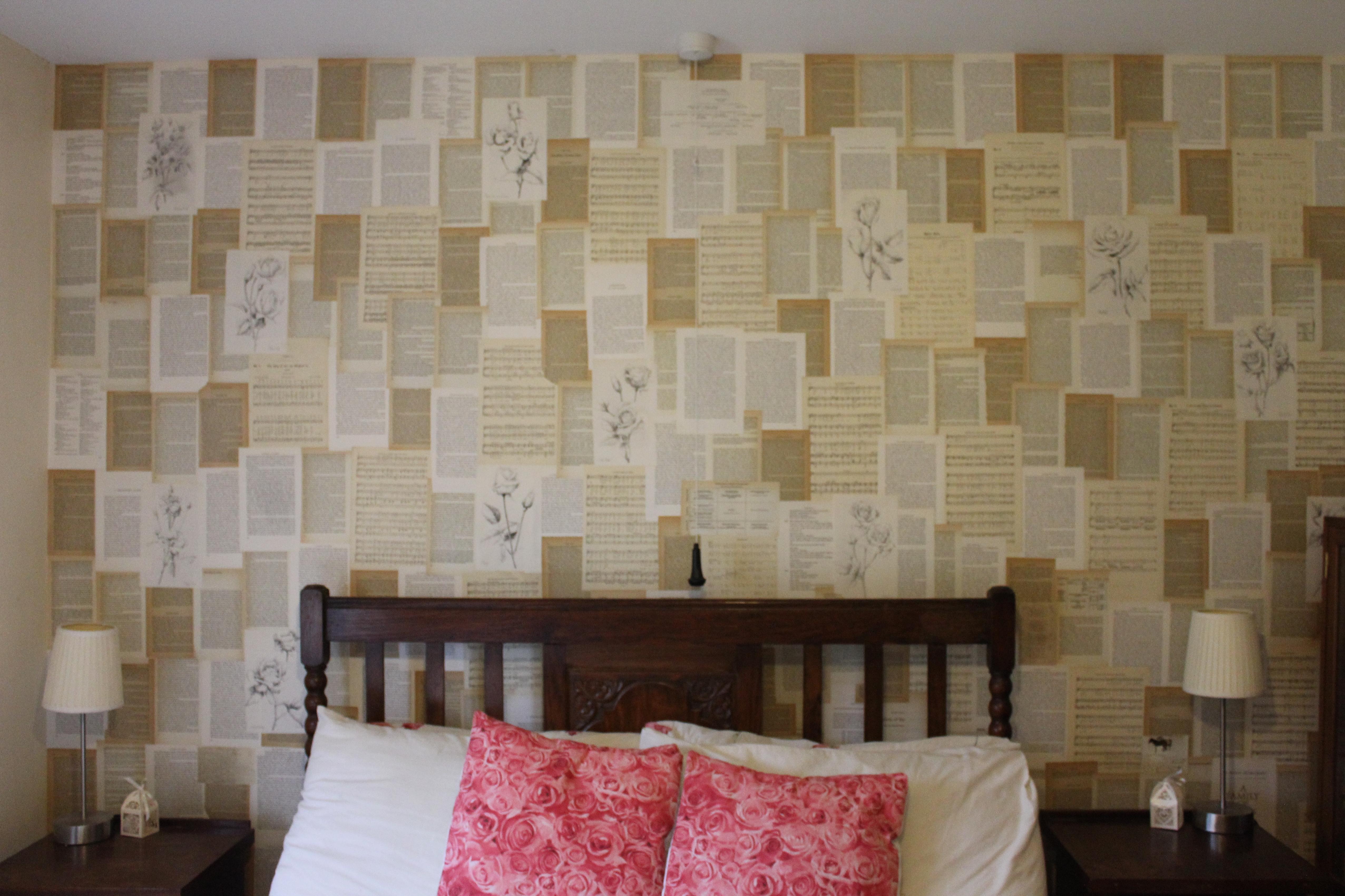 DIY wallpaper for bedroom makeover using pages from old books and sheet music