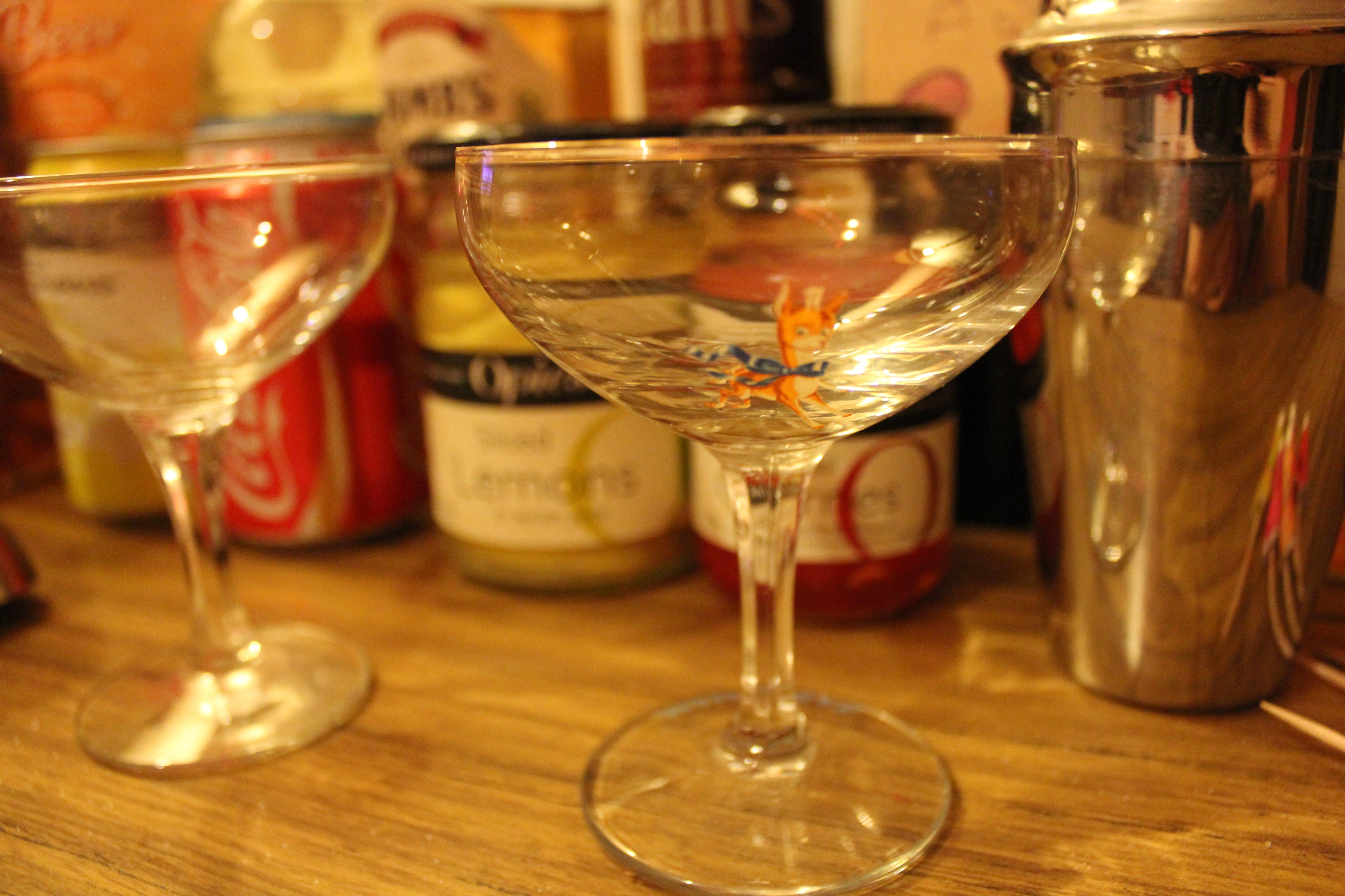 cocktail making with retro babycham champagne glasses