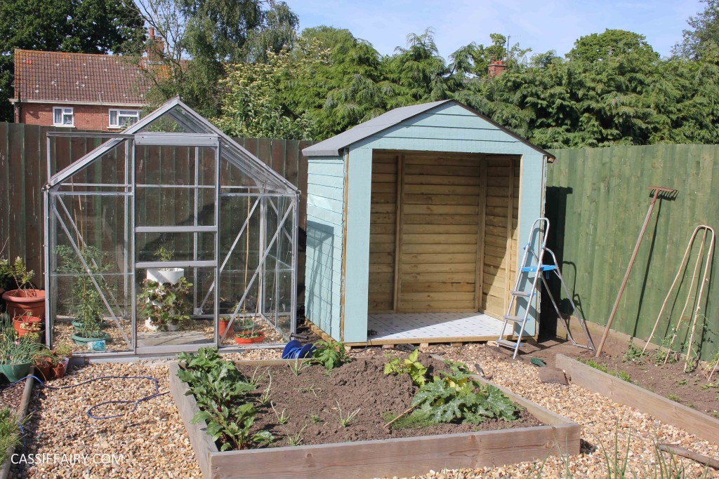 diy painting and installing small shed - duck egg blue beach hut in garden-11