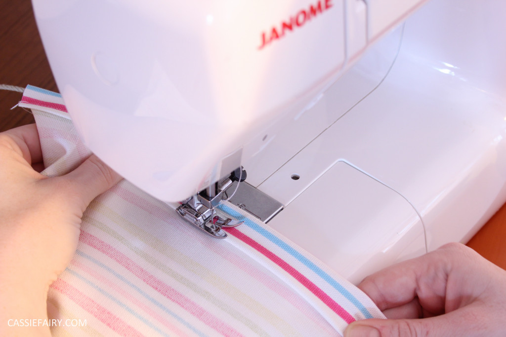 photo of a sewing machine stitching a straight line