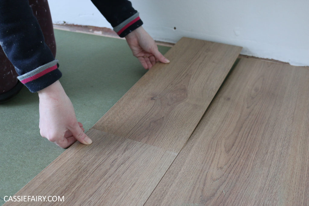 installing laminate flooring plank on floor