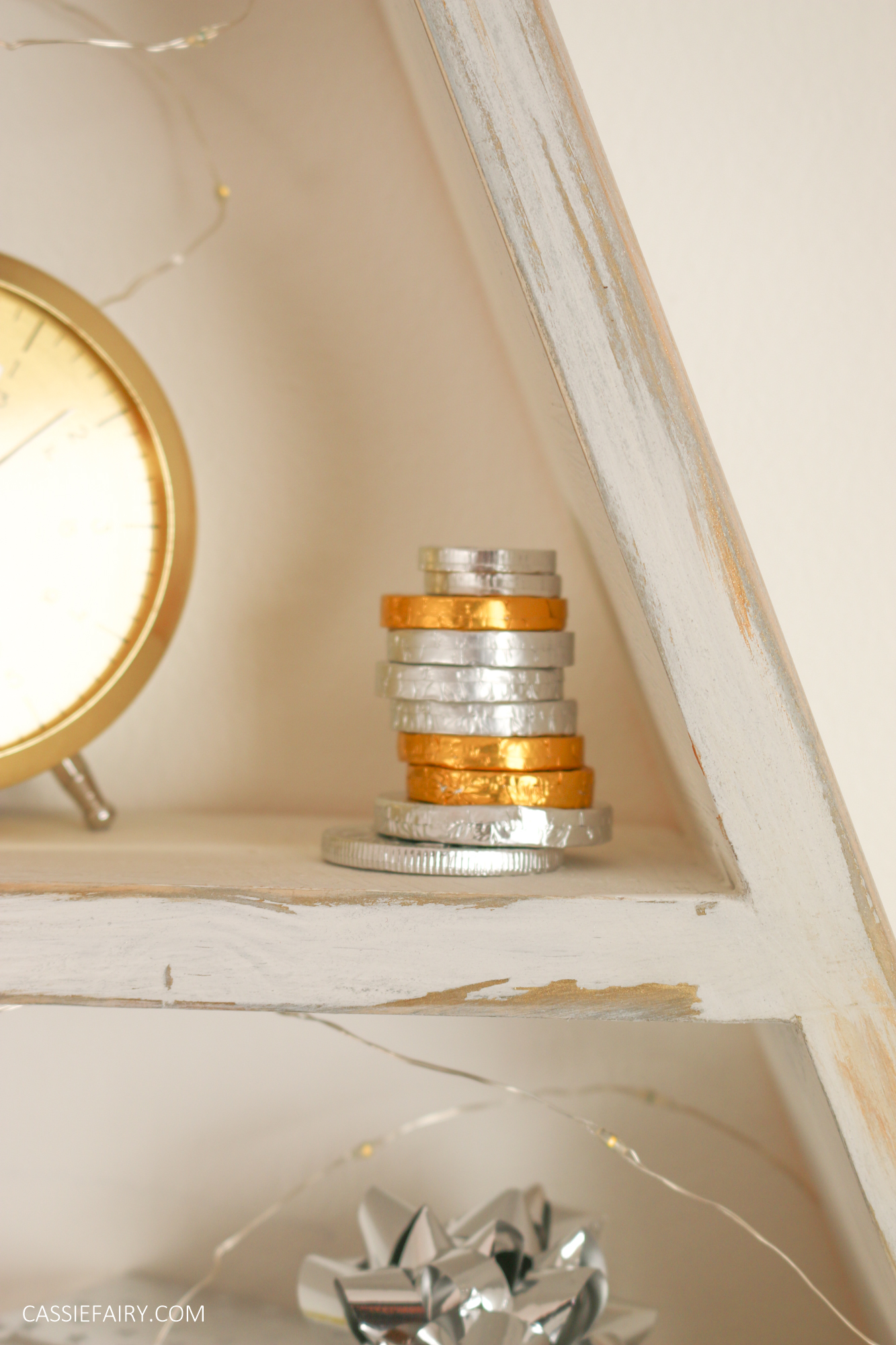A stack of gold and silver chocolate coins. 