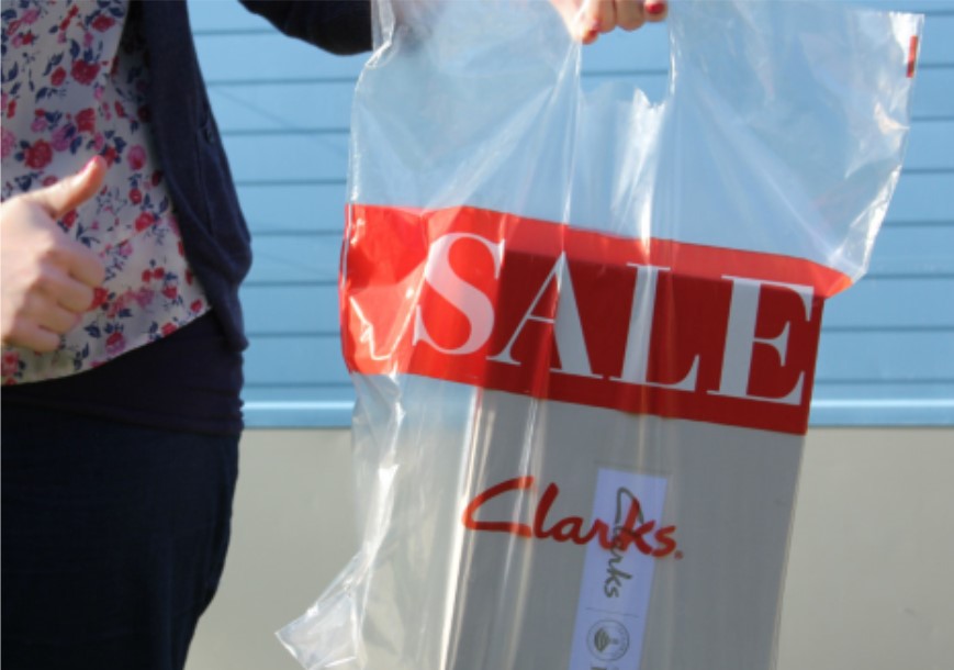 Photo of a shopping bag with the word 'sale' on the front