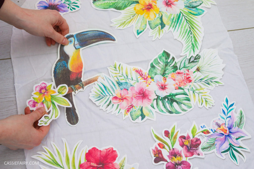 Photo of tropical iron-on transfer designs being positioned onto fabric.