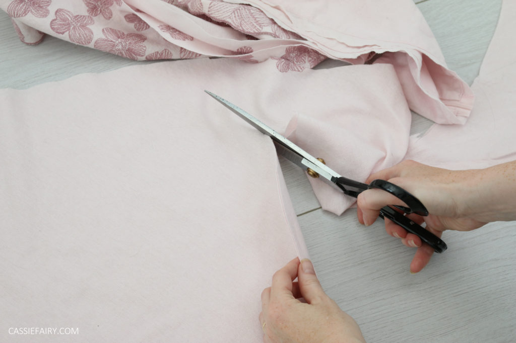 photo of fabric being cut by a pair of fabric shears