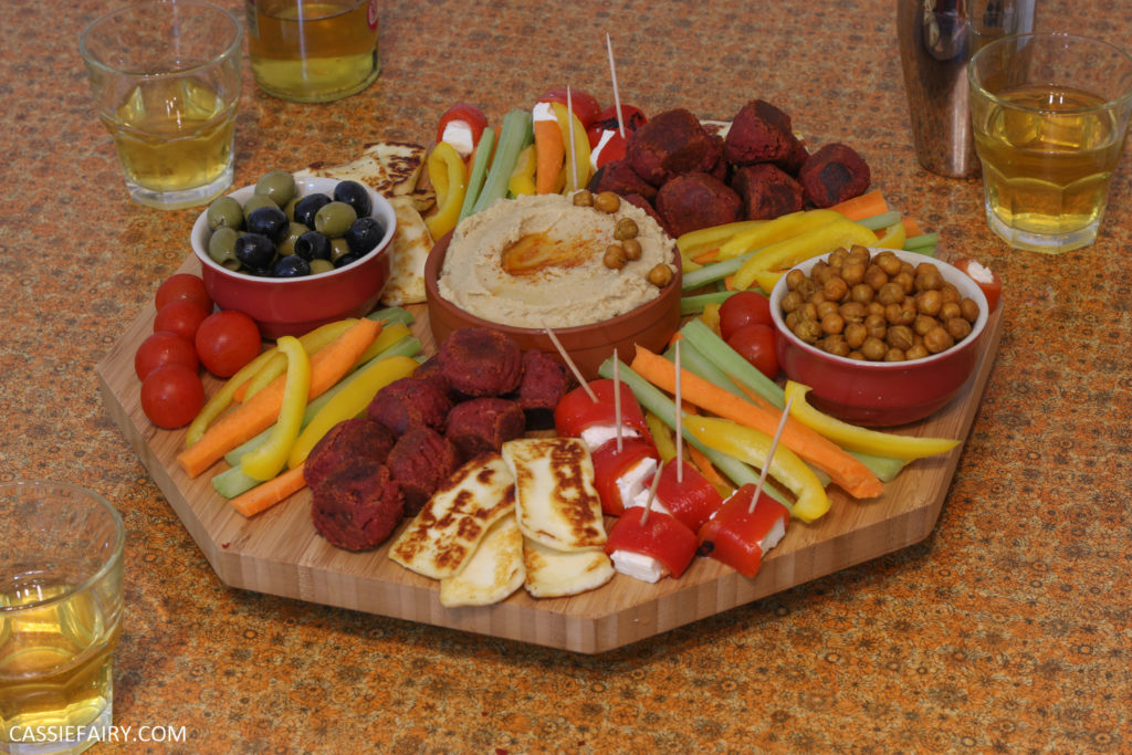 A platter of vegetables, haloumi, and chickpea hummus.