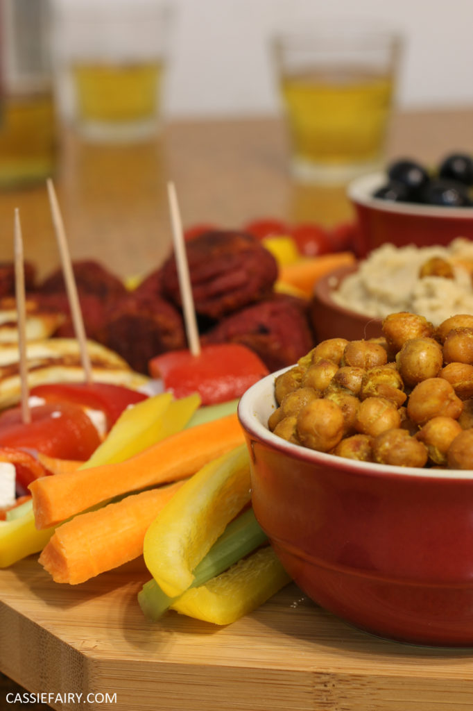 A platter of vegetables, haloumi, and roasted chickpeas.