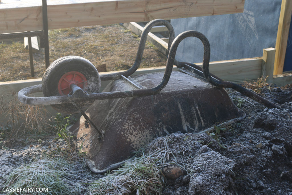 Photo of upside down wheelbarrow, covered in frost