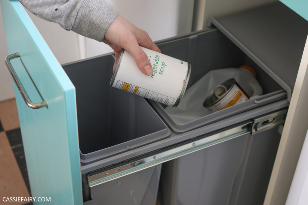 Photo of a tin being put into a recycling bin