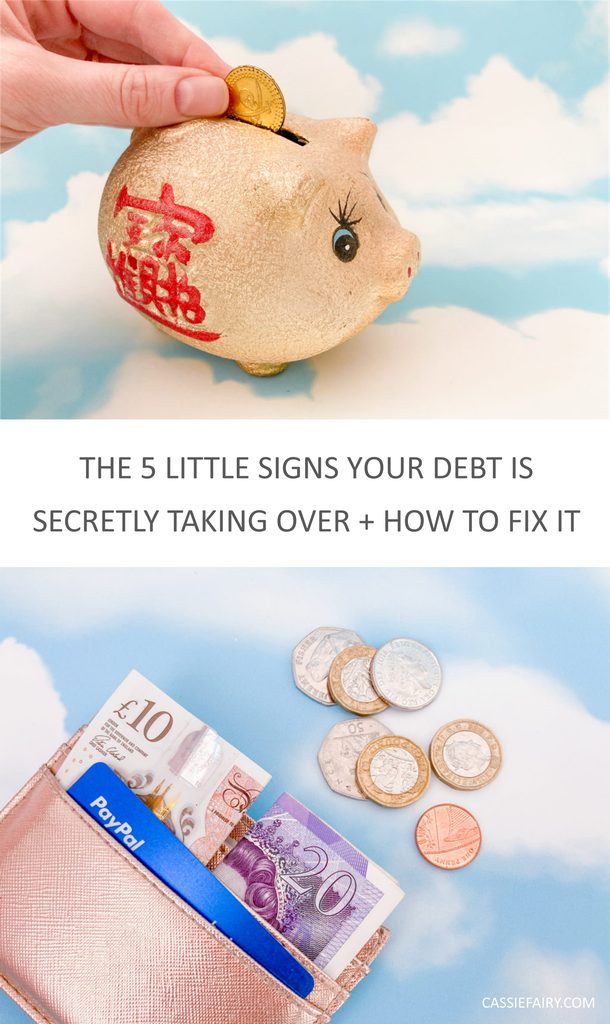 The 5 little signs your debt is secretly taking over and how to fix it pinnable image of a piggy bank