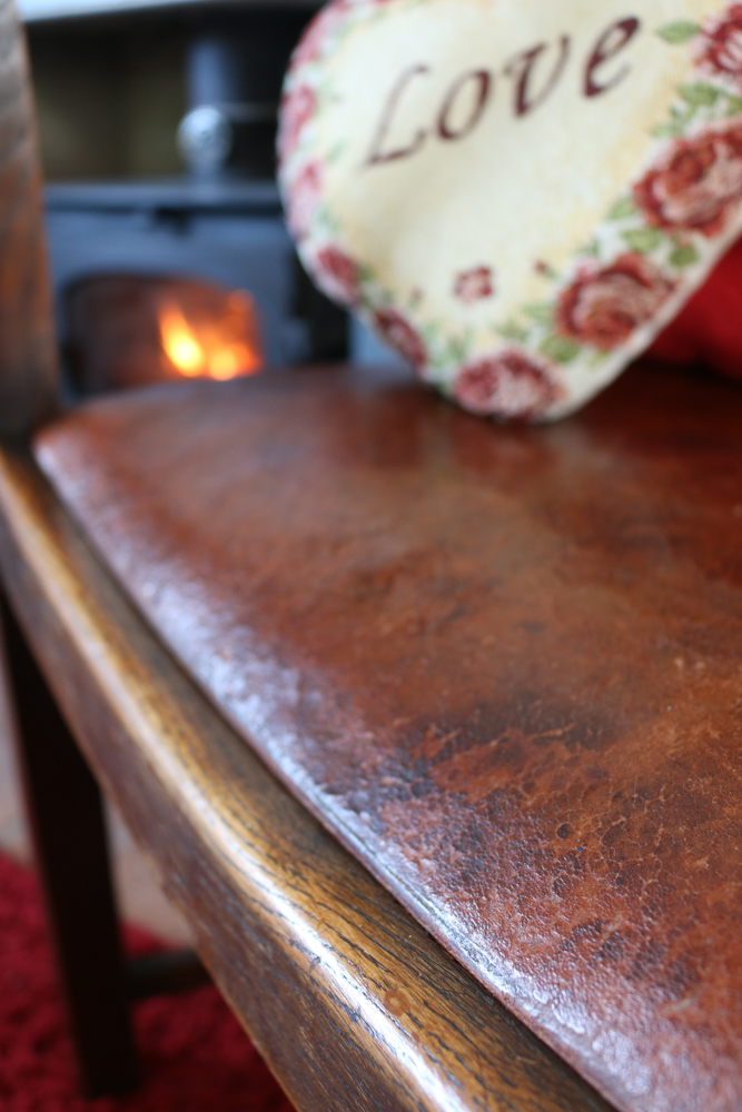 The repaired polished from of the chair seat with no split visible.
