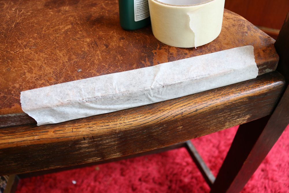 Masking tape holding the split edge of the leather together until the glue dries. 